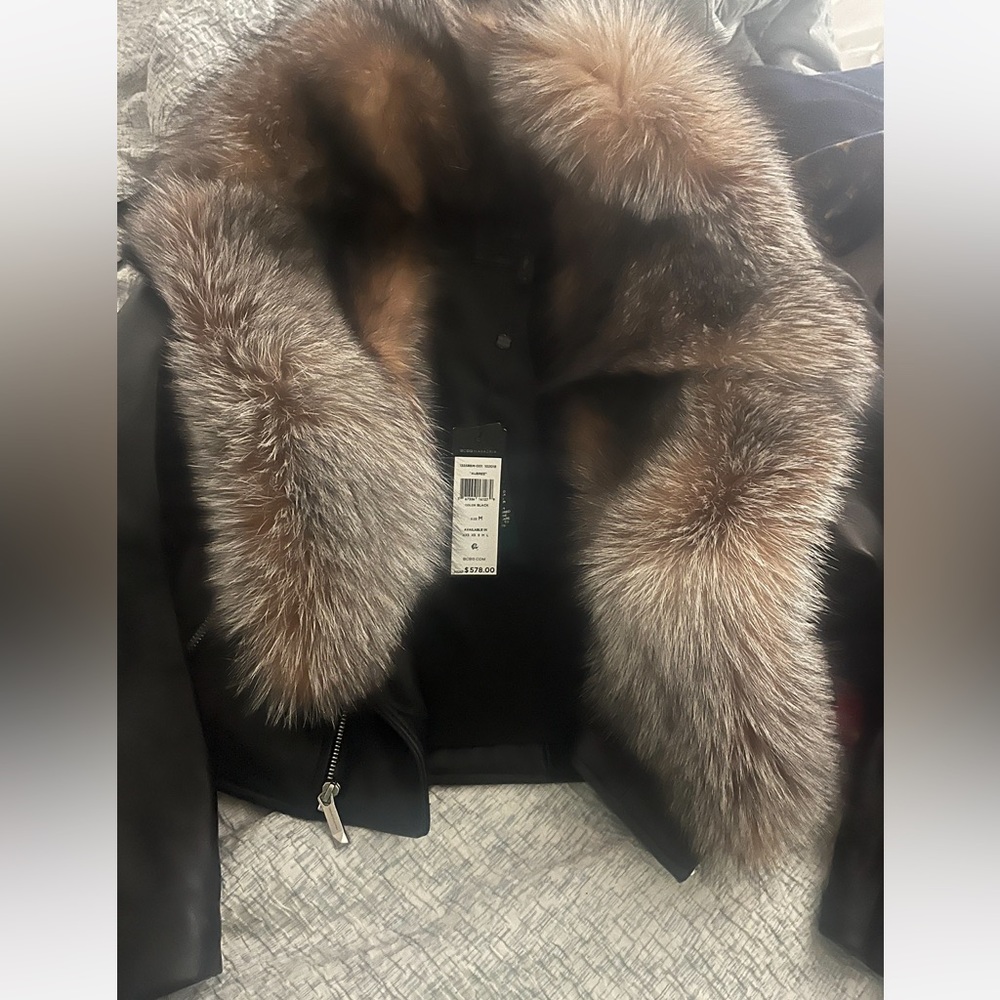 Bcbgmaxazria black leather cropped jacket with real fur collar.
